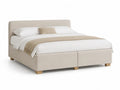 Lit double en tissu beige avec pieds en hêtre